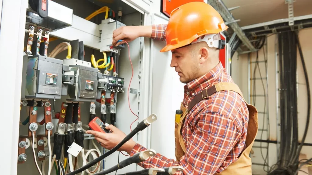 Skilled electrician providing electrical services for panel repair