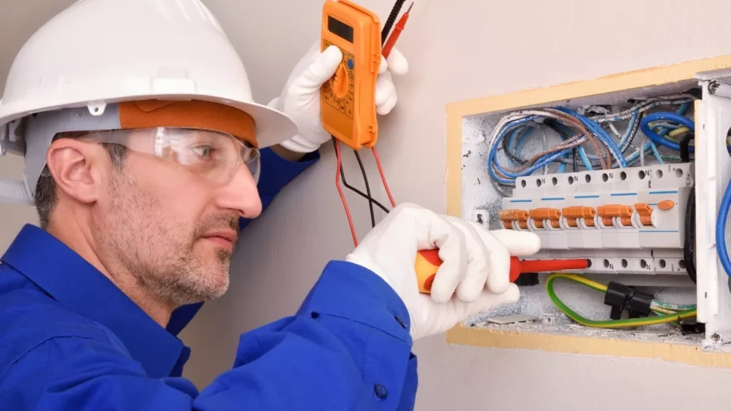 Professional electrician services handling electrical panel maintenance safely